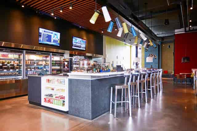 Alt Hotel Toronto networking mixer with high-top seating and AV branding for corporate events.