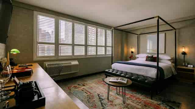 Upscale Anndore House guest room with modern workspace for executive business travel.