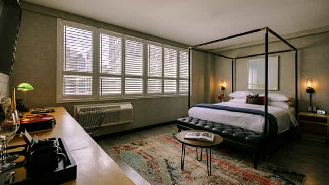Upscale Anndore House guest room with modern workspace for executive business travel.