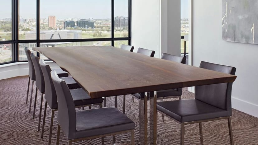 Boardroom setup with live-edge table at Sheraton Toronto North for executive strategy meetings.
