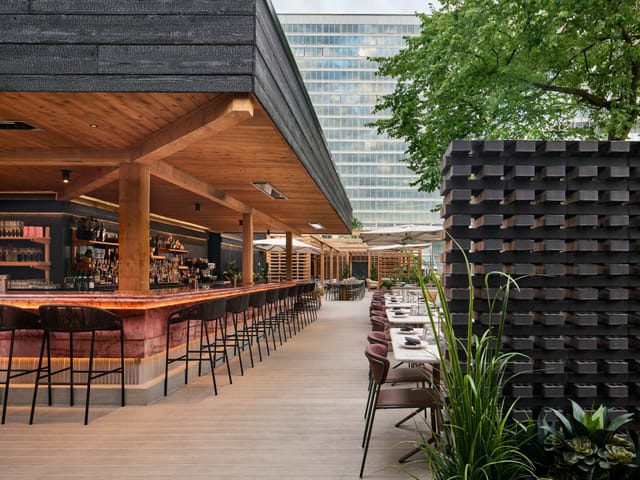 Outdoor terrace at The Quay with modern bar, perfect for corporate events and networking mixers.