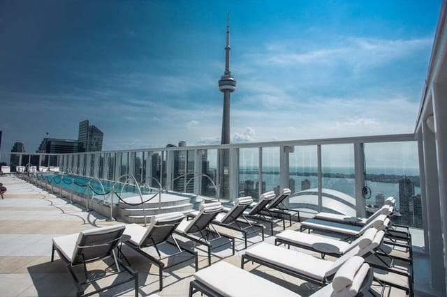 Rooftop restaurant at Bisha Hotel Toronto with skyline view for corporate cocktail networking events.