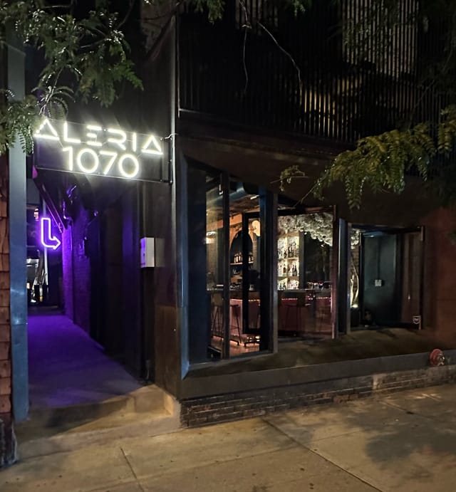 Upscale Aleria restaurant interior with moody lighting for evening reception and gala events.