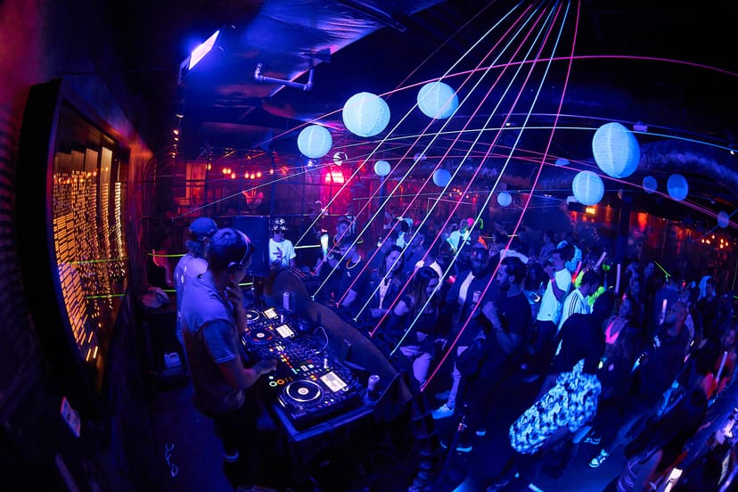 Neon-lit dance floor at Rebel INK concert hall: experiential event and live music venue.