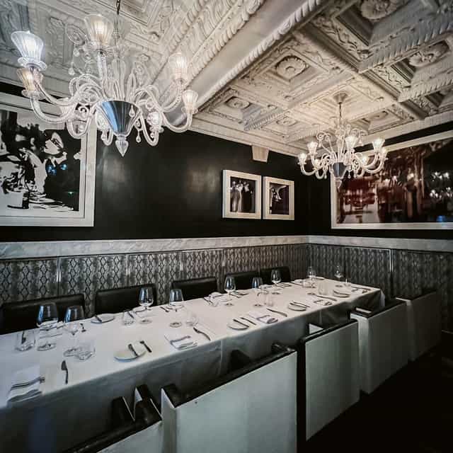Private dining room at Harbour Sixty with crystal chandeliers for VIP corporate dinners.