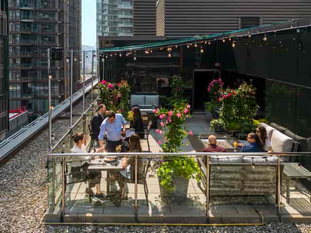 Le Germain rooftop terrace lounge setup for premium networking mixer event.
