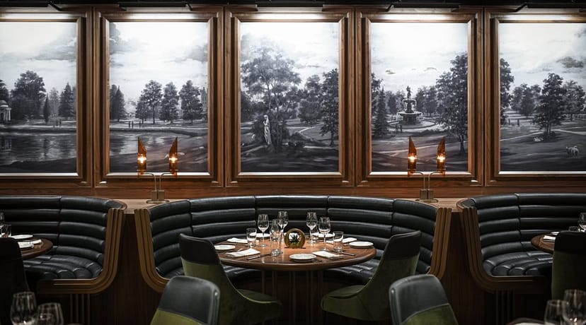 Plush banquette seating in a private dining room for VIP dinners and corporate networking.