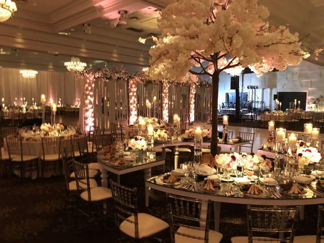 Luxury ballroom with vertical floral decor for elegant wedding and gala events.