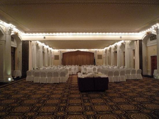 Pillar-lined ballroom at Omni Mount Washington Resort for corporate conference or banquet event.
