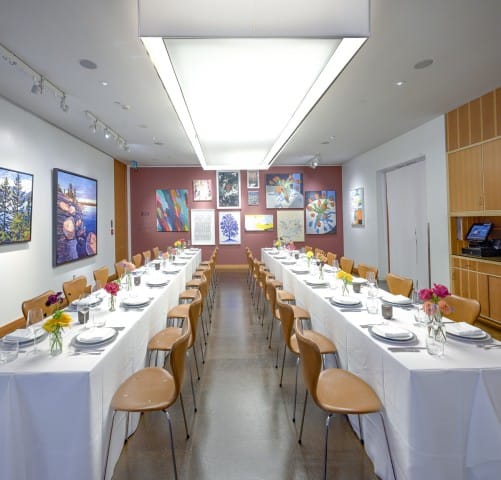 Private dining at AGO Bistro: gallery-style banquet tables for corporate events and networking.
