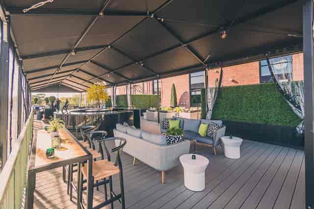 Rooftop terrace at The Symes with lounge seating for networking receptions and corporate events.