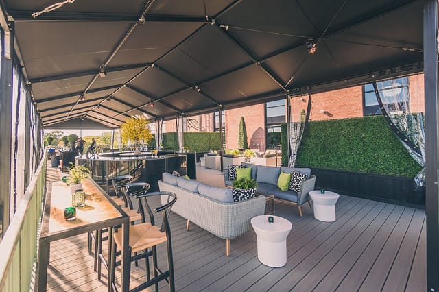 Rooftop terrace at The Symes with lounge seating for networking receptions and corporate events.