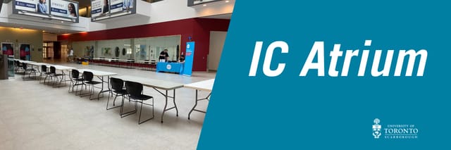 Registration desk at UTSC KW Atrium for university conference or event setup.