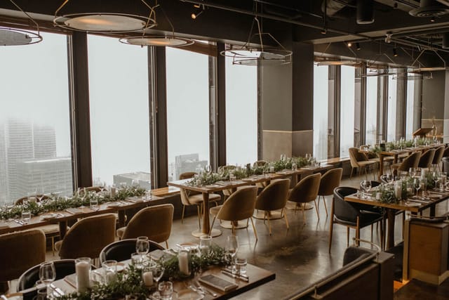 Modern event space at Canoe with floor-to-ceiling city views for corporate dinners or weddings.