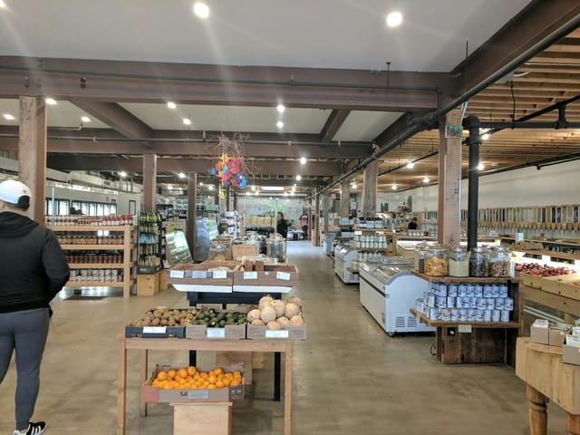Kensington Market industrial-chic venue for pop-up markets and networking mixers with exposed beams.
