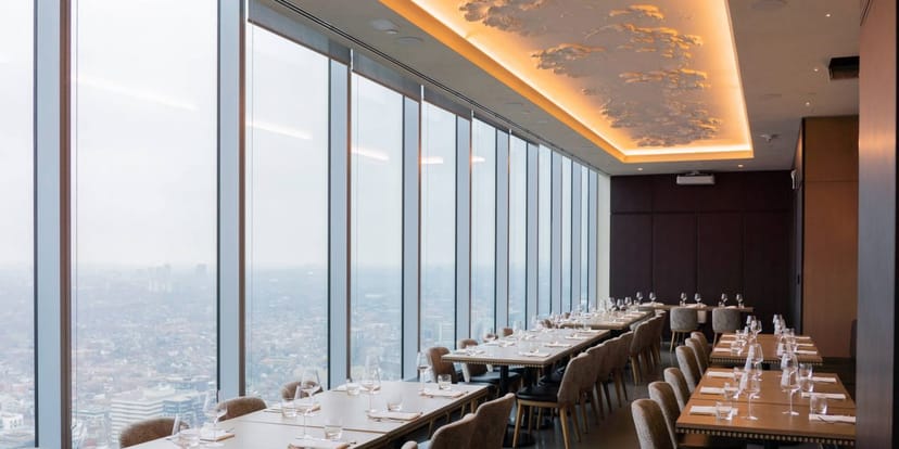 VIP dining room at Aera with skyline views, perfect for executive functions and luxury events.