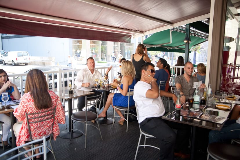 Patio at Dimmi Trattoria: outdoor setting for casual conference networking and happy hour events.