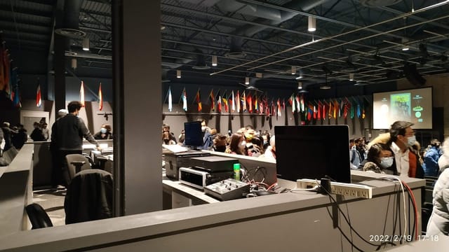 A/V production booth overlooking a Toronto Pavilion plenary hall for corporate event conferences.