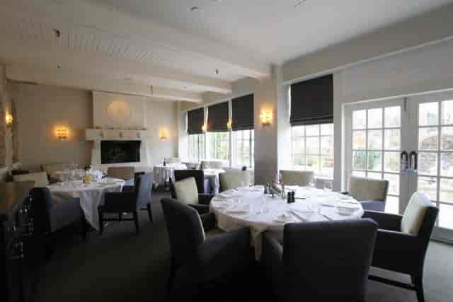 Auberge du Pommier private dining room with fireplace for corporate events and board meetings.