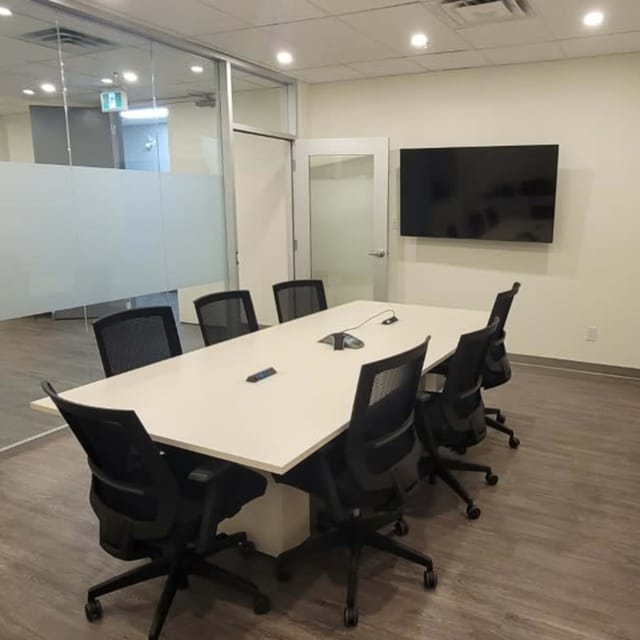 Breakout room at IKON Event Space with AV setup for hybrid meetings and corporate workshops.