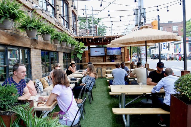 Patio at Petty Cash: Bistro-lit outdoor venue for networking mixer and corporate event space.
