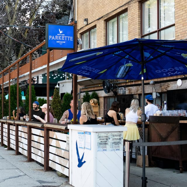 Patio breakout session at Petty Cash featuring high-top tables for informal event networking.
