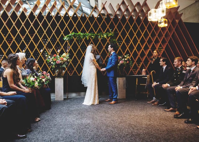 South Room at Jump: Symmetrical architectural backdrop for intimate wedding ceremonies.