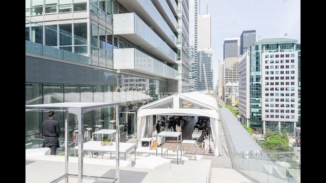 Modern rooftop lounge with modular seating and city views for corporate cocktail events.