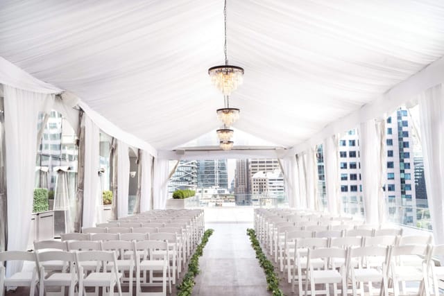 SixtyEight terrace wedding venue with ceiling draping for formal event presentations.