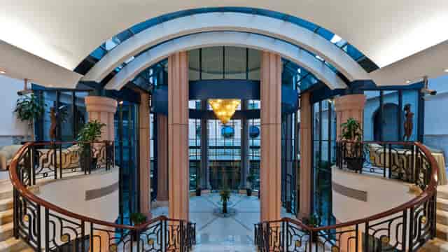High-end hotel atrium for gala events and corporate networking receptions.
