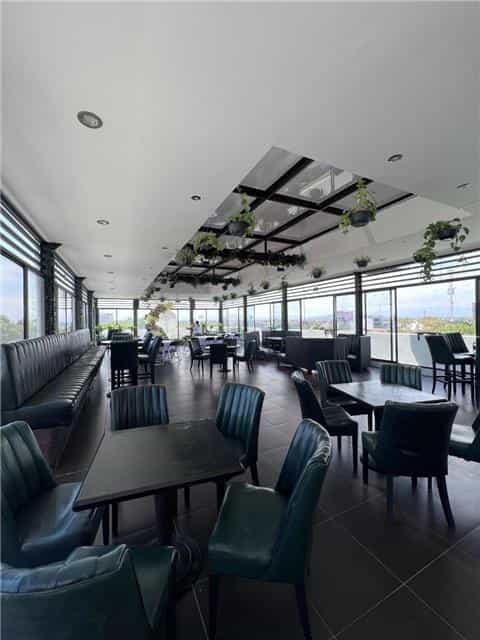 Modern Beirut rooftop terrace with floor-to-ceiling glass for corporate events and social mixers.