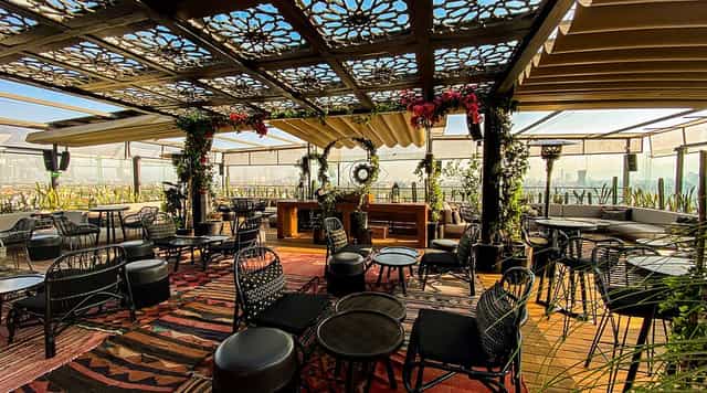 Geometric rooftop function room, perfect for high-end networking events and sunset receptions.