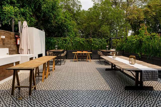 Al fresco workshop reception at Terrace in Brocante with trestle seating for garden-style events.