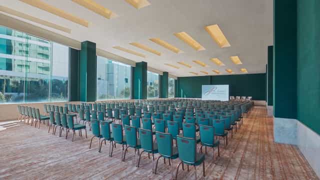 Theater-style conference room at Grand Fiesta Americana with natural light for corporate events.