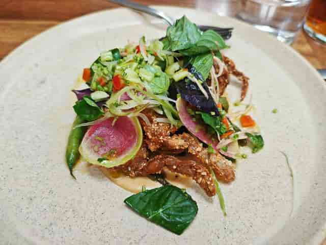 High-end banquet entrée on Meroma CDMX terrace for upscale networking luncheon catering.