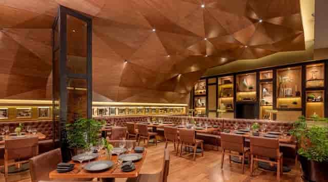 Upscale Alfredo Di Roma dining room with wood decor for executive dinners and networking events.