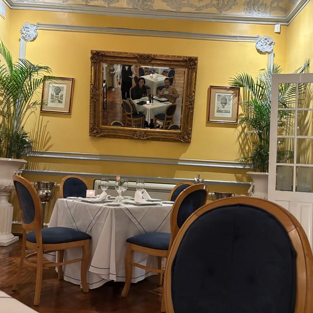 VIP boardroom dining at Les Moustaches with crisp linens for high-end corporate event sessions.