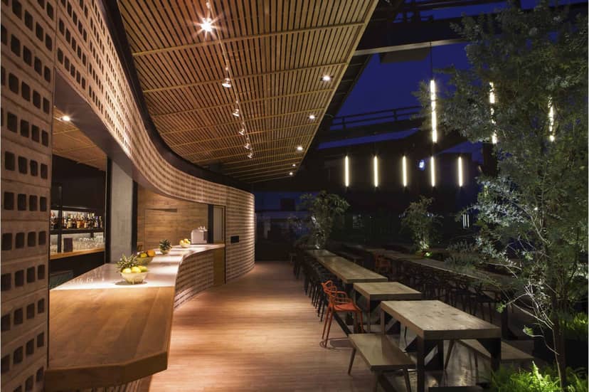 High-end rooftop bar in Balmori Roma with ambient lighting for networking reception events.