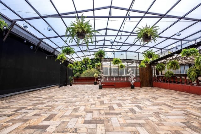 BENIU covered open-air event space with biophilic design for cocktail receptions and yoga retreats.
