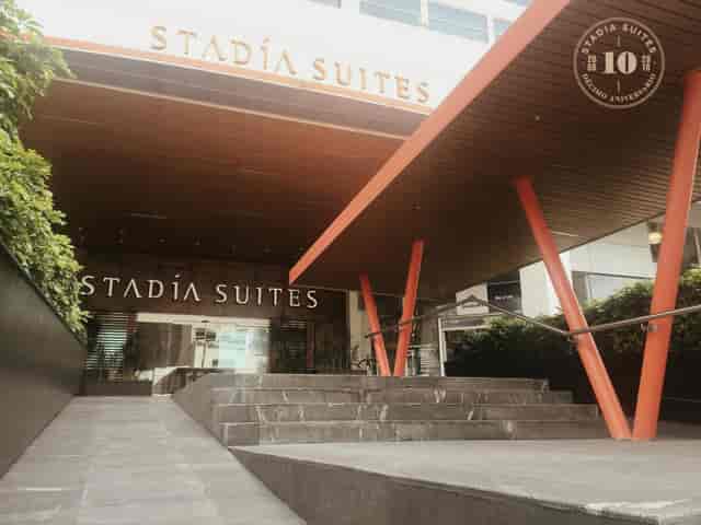 Modern hotel entrance with tiered steps at Fuego, Mexico City for event venue accessibility.