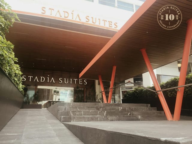 Modern hotel entrance with tiered steps at Fuego, Mexico City for event venue accessibility.