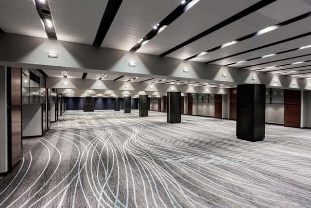 Modern ballroom at Hilton Mexico City Reforma with structural pillars for flexible event planning.