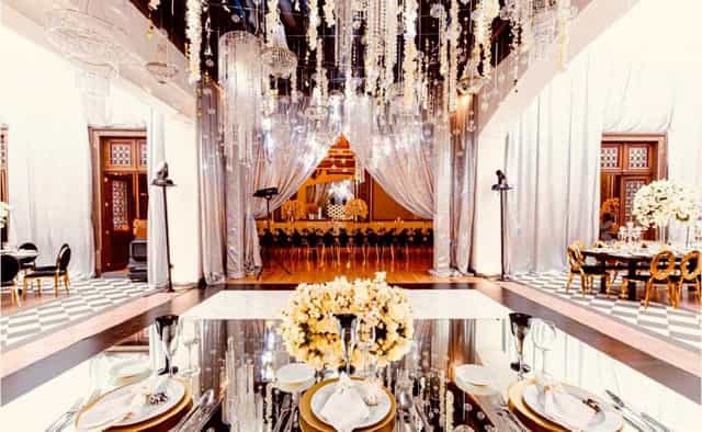 Salón Morisco event with floral chandeliers and mirrored decor for luxury gala and wedding design.