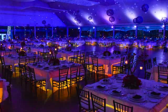 Blue-lit ballroom at La Foret Salon y Banquetes for gala and banquet event hosting.