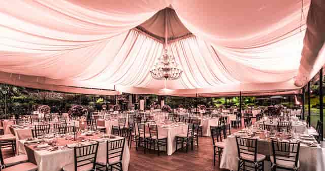 Luxury banquet hall marquee with chandelier, perfect for elegant wedding and corporate events.