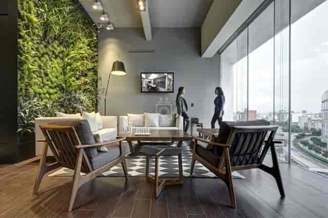 Biophilic coworking space with modern lounge seating for executive networking and business events.