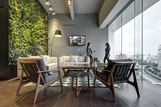 Biophilic coworking space with modern lounge seating for executive networking and business events.