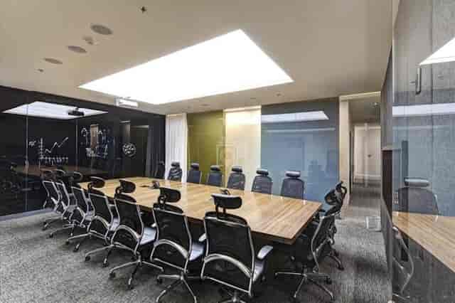 Modern IZA Business Center boardroom with long table for strategic planning and executive meetings.