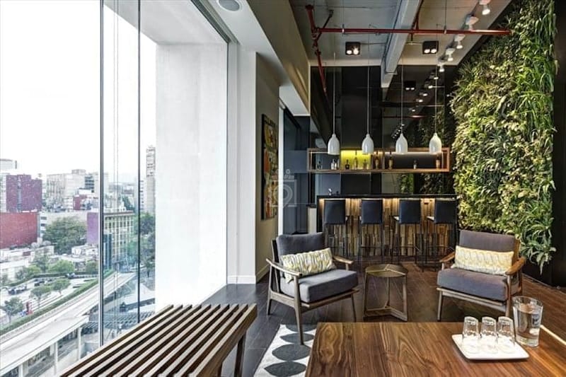 Modern coworking lounge with biophilic design for networking events and executive meetings.