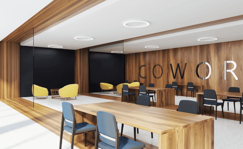 Modern coworking office with collaborative bench seating for business meetings and networking.